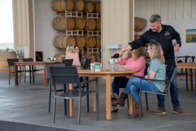 Winemaker Chad pouring wine.