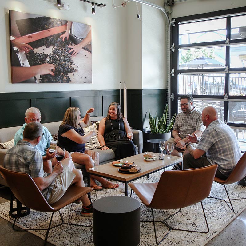 People at a table in Edmonds Wine Bar.